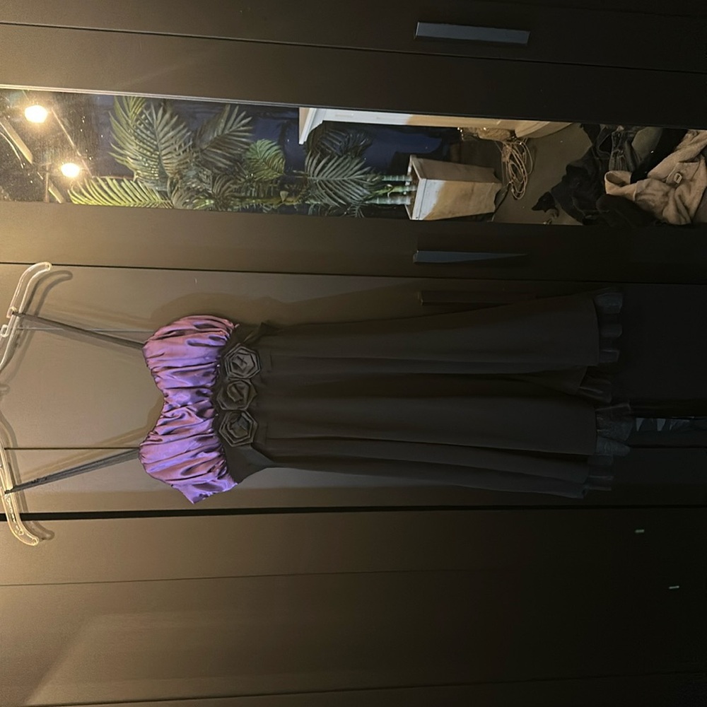 A pretty cute purple and black dress! Perfect for homecoming or any party